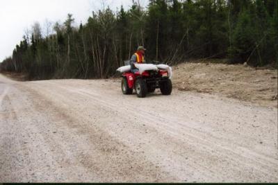 Jeff Johnston seeding a reclamation mixture along logging roads to prevent erosion